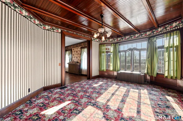 a kitchen with stainless steel appliances granite countertop a refrigerator and a stove