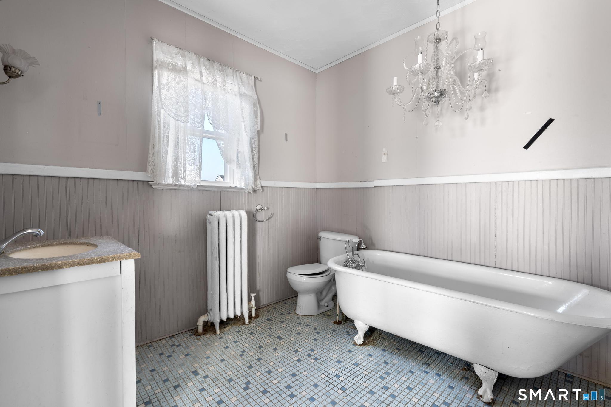4 Fairview Terrace Derby, CT 06418 - Photo 16 of 34 a bathroom with a sink toilet and a window