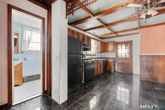 a room with wooden floor and a mirror