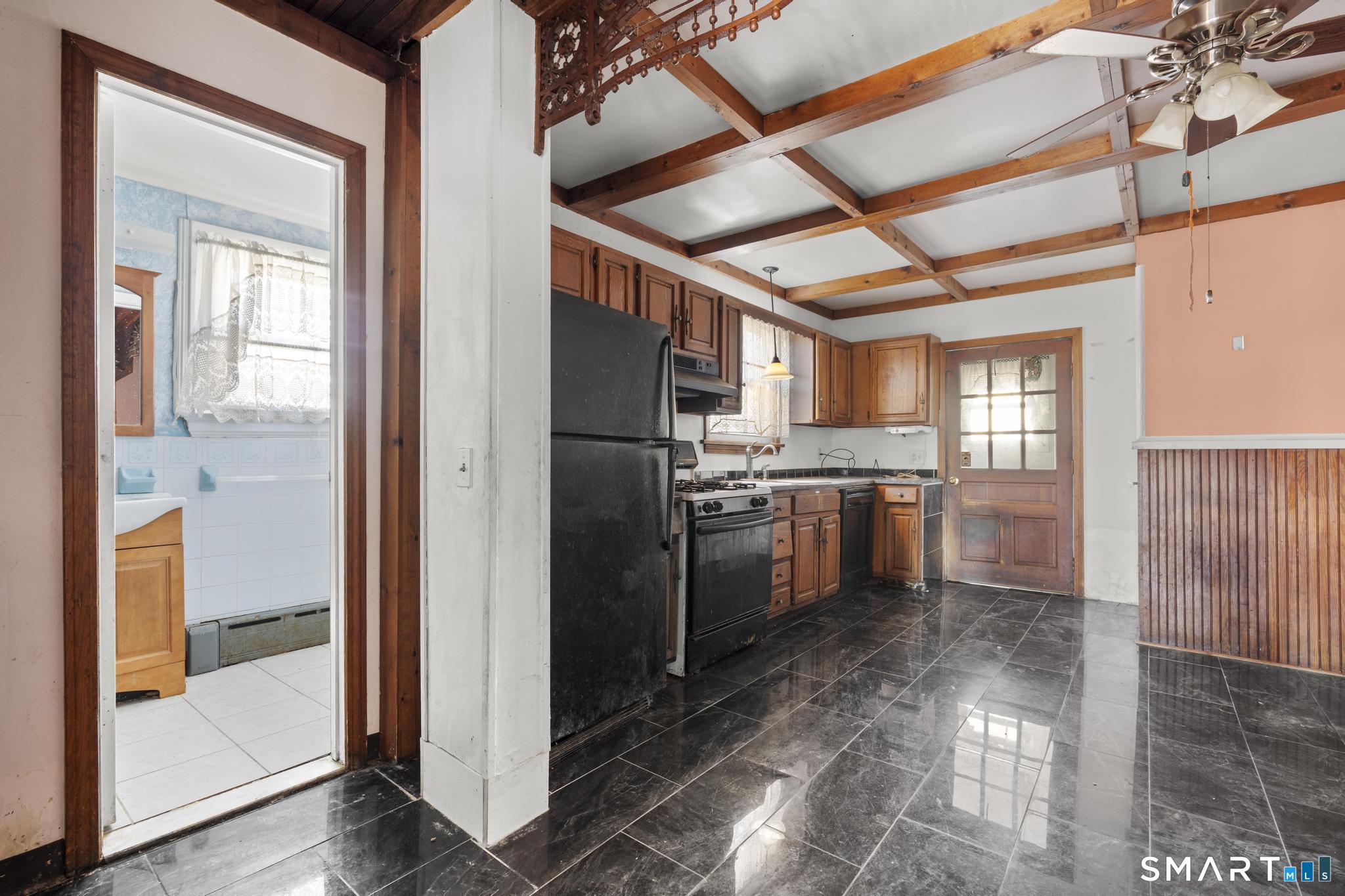 4 Fairview Terrace Derby, CT 06418 - Photo 17 of 34 a kitchen with a refrigerator and white cabinets