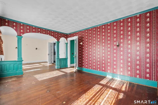 a bathroom with a sink toilet and a window
