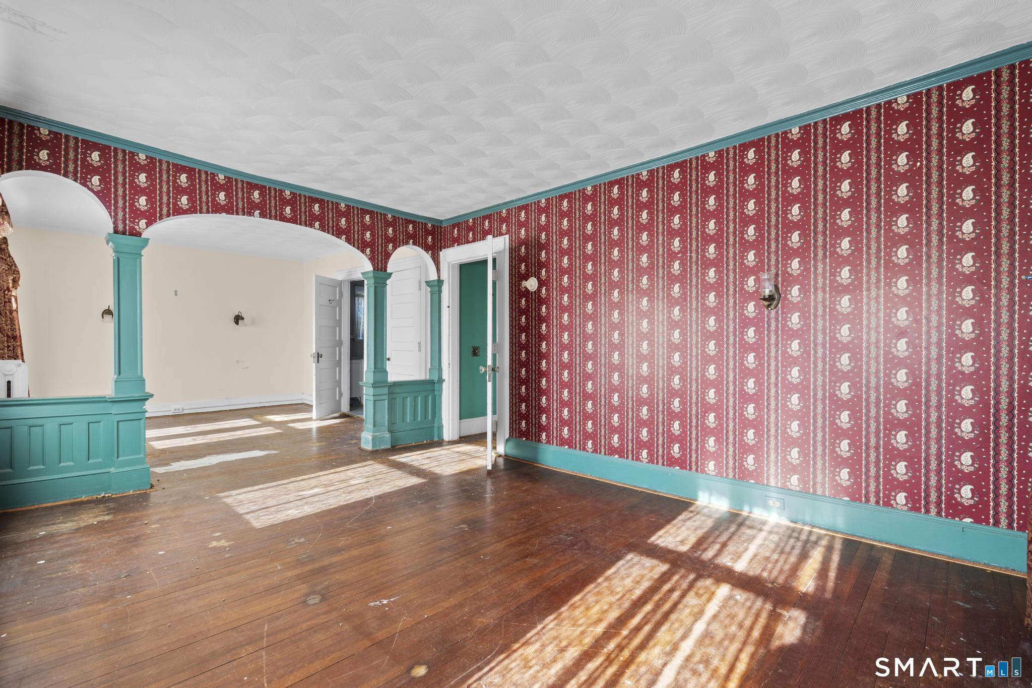 4 Fairview Terrace Derby, CT 06418 - Photo 22 of 34 a view of an empty room with floor to ceiling window and stairs