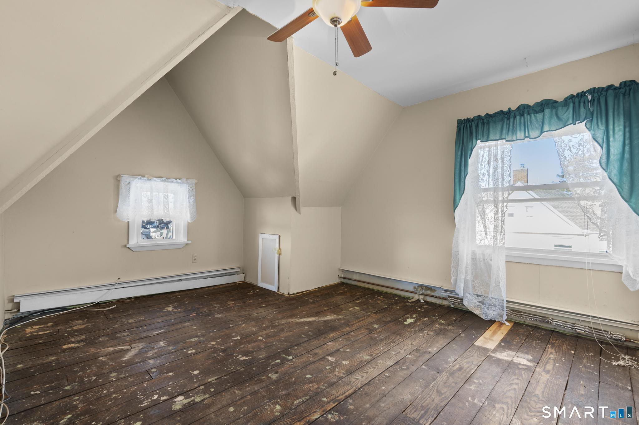 4 Fairview Terrace Derby, CT 06418 - Photo 25 of 34 an empty room with wooden floor cabinet and windows