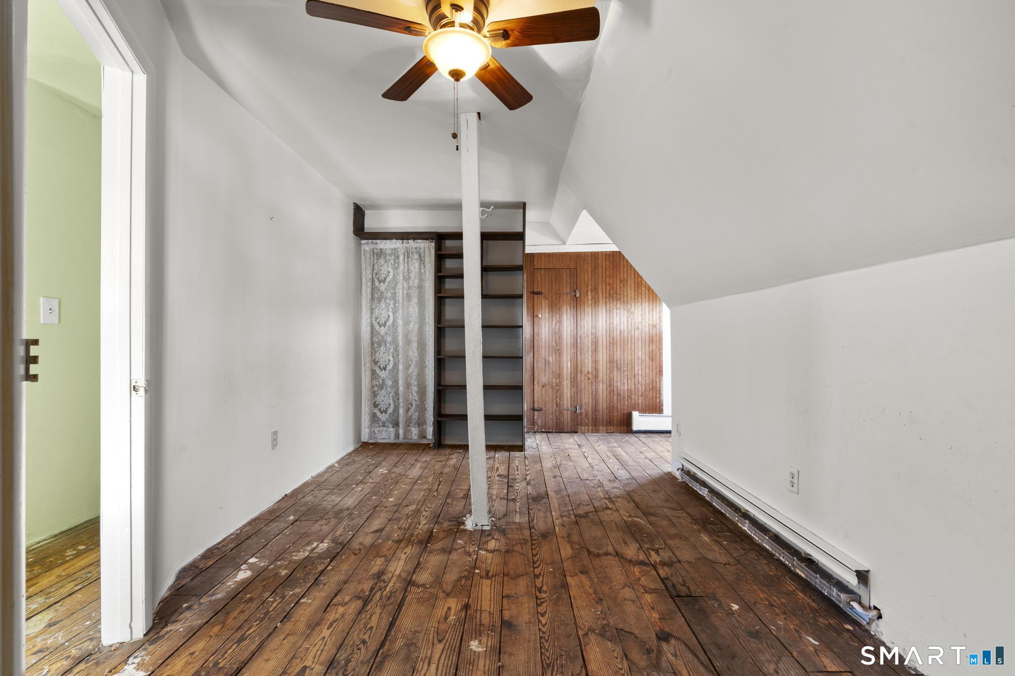 4 Fairview Terrace Derby, CT 06418 - Photo 26 of 34 a view of an empty room with wooden floor and fan