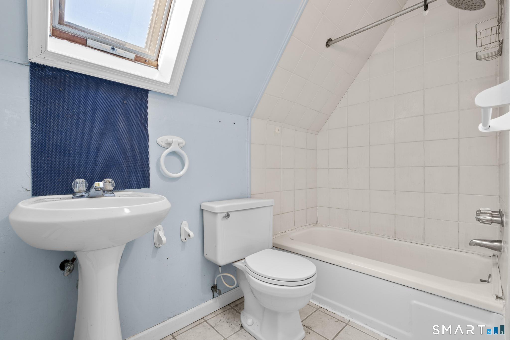 4 Fairview Terrace Derby, CT 06418 - Photo 29 of 34 a bathroom with a sink a toilet and shower