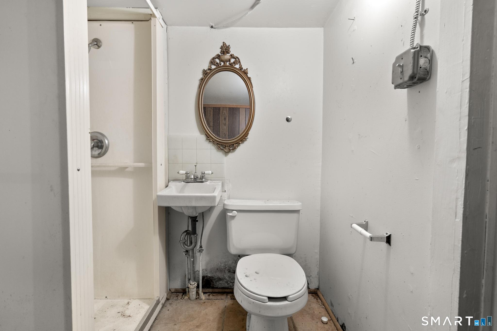 4 Fairview Terrace Derby, CT 06418 - Photo 30 of 34 a bathroom with a toilet sink and mirror