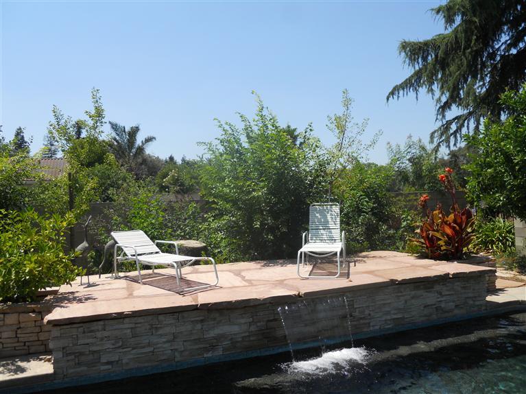 19472 Farallon Road Madera, CA 93638 - Photo 24 of 37 Waterfall and Arizona flagstone decking.