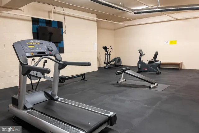 a view of a chair and table in backyard of the house