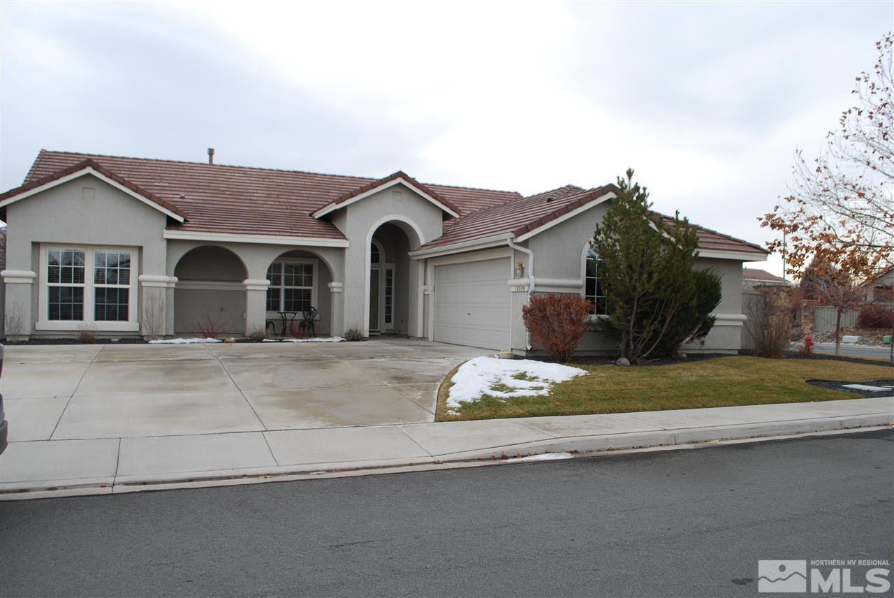 10590 Iron Ridge Court Reno, NV 89521 - Photo 1 of 1 a front view of a house with a garden