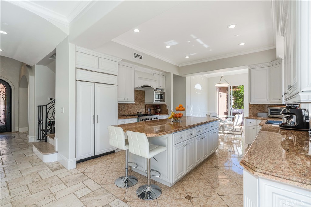 11 Baymare Road Bell Canyon, CA 91307 - Photo 11 of 39 a large kitchen with stainless steel appliances granite countertop a stove and a sink