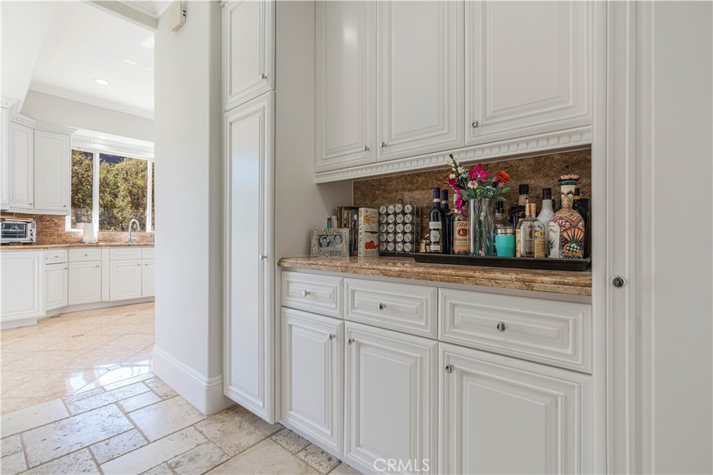 11 Baymare Road Bell Canyon, CA 91307 - Photo 15 of 39 a kitchen with white cabinets and window