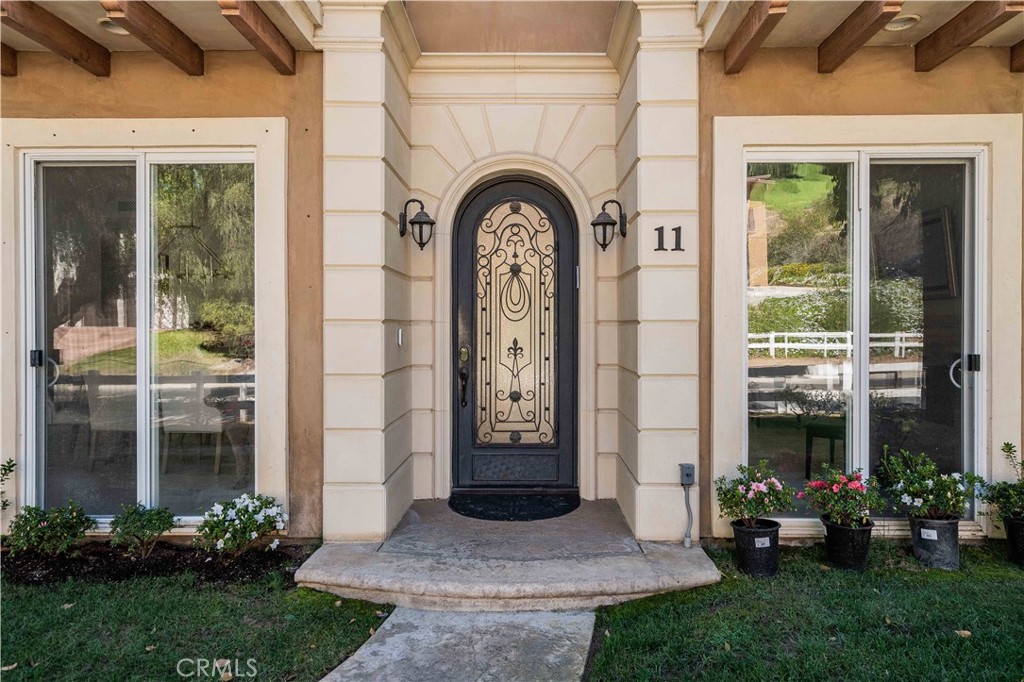 11 Baymare Road Bell Canyon, CA 91307 - Photo 2 of 39 a front view of a house with garden