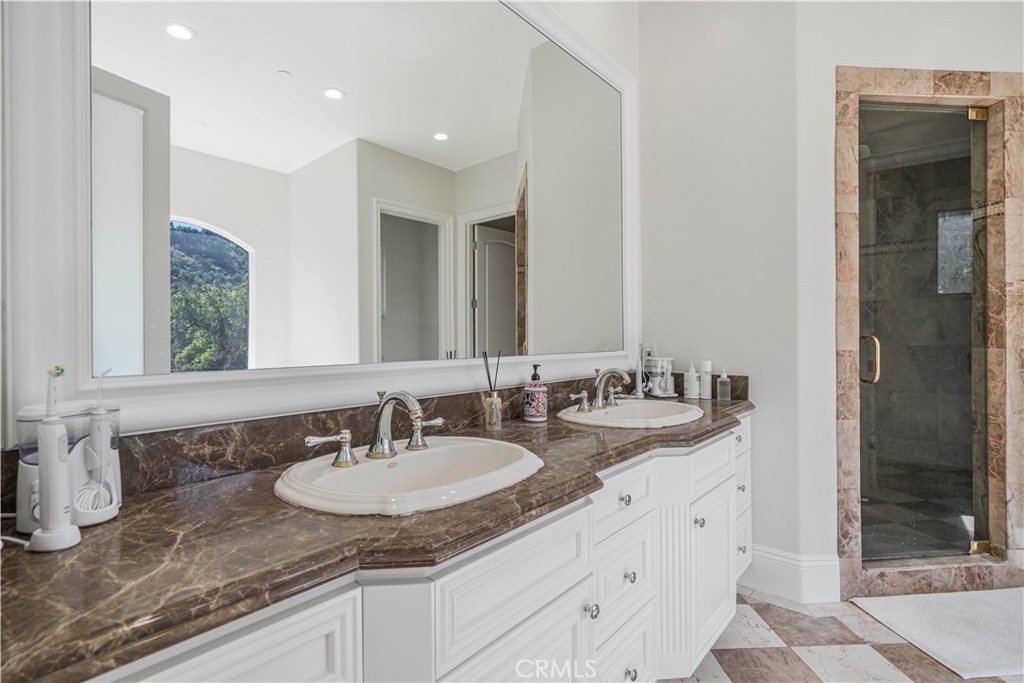 11 Baymare Road Bell Canyon, CA 91307 - Photo 23 of 39 a bathroom with double sink and a mirror