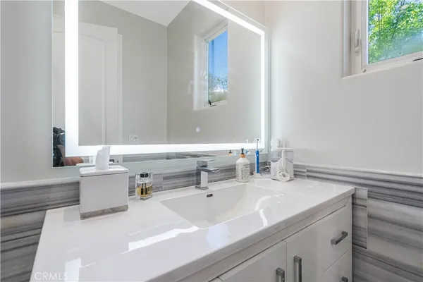 a bathroom with a sink and a mirror