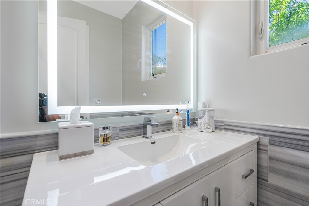 11 Baymare Road Bell Canyon, CA 91307 - Photo 27 of 39 a bathroom with a sink and a mirror