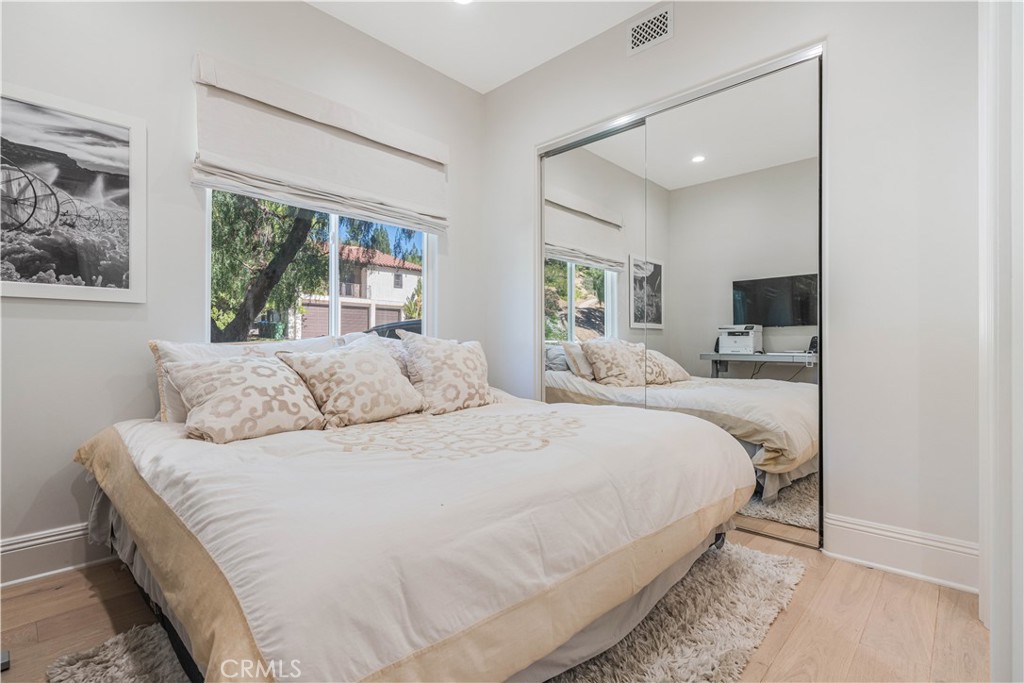 11 Baymare Road Bell Canyon, CA 91307 - Photo 33 of 39 a bedroom with a large bed and a flat tv screen