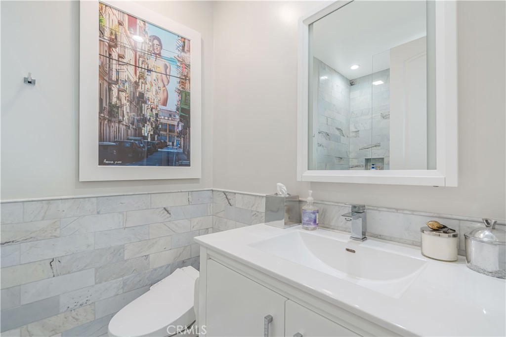 11 Baymare Road Bell Canyon, CA 91307 - Photo 34 of 39 a bathroom with a toilet sink and mirror