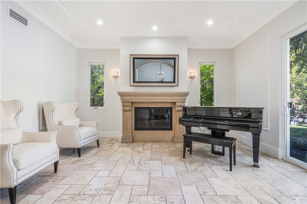11 Baymare Road Bell Canyon, CA 91307 - Photo 5 of 39 a living room with furniture and a fireplace