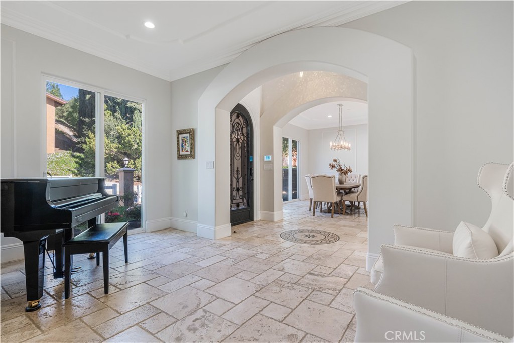 11 Baymare Road Bell Canyon, CA 91307 - Photo 8 of 39 a living room with furniture a table and large windows with wooden floor