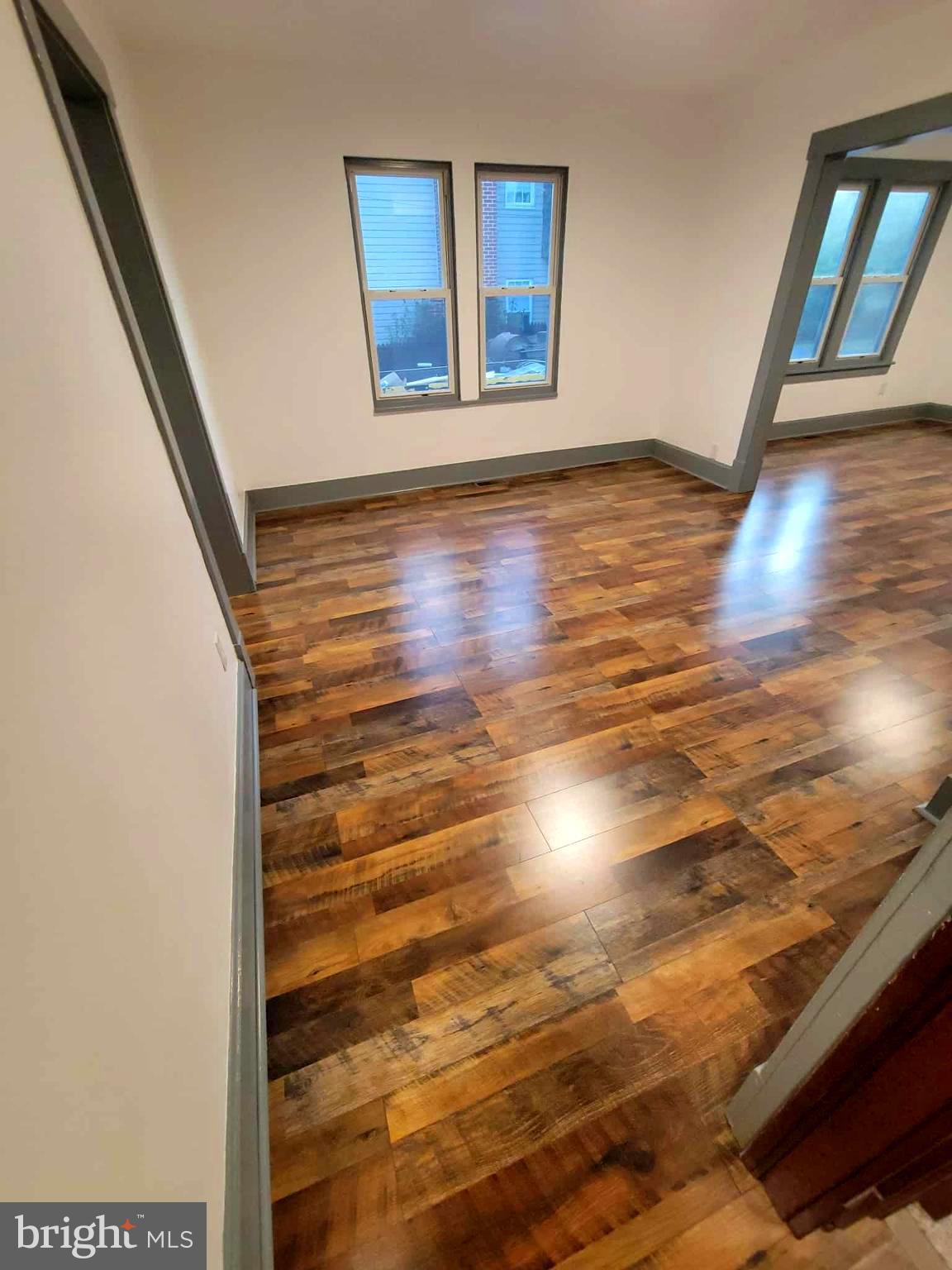 14204 Temple Street Ellerslie, MD 21529 - Photo 11 of 31 a view of an empty room with wooden floor and a window