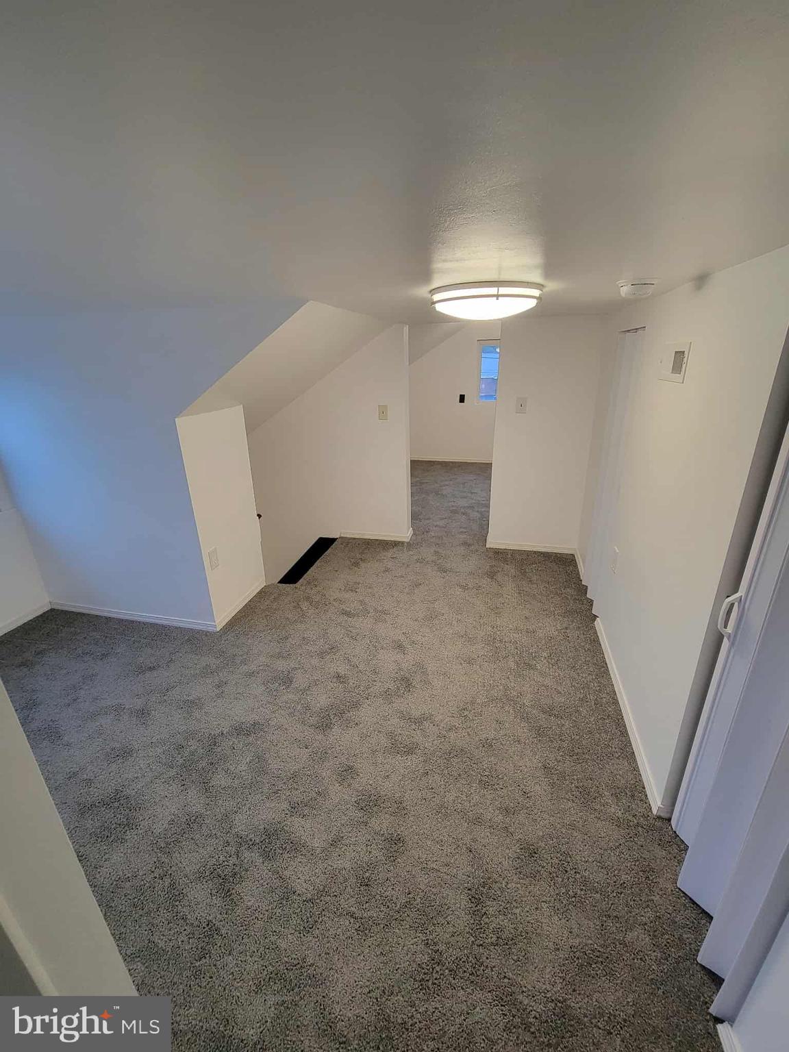 14204 Temple Street Ellerslie, MD 21529 - Photo 20 of 31 a view of a room with a ceiling fan and window