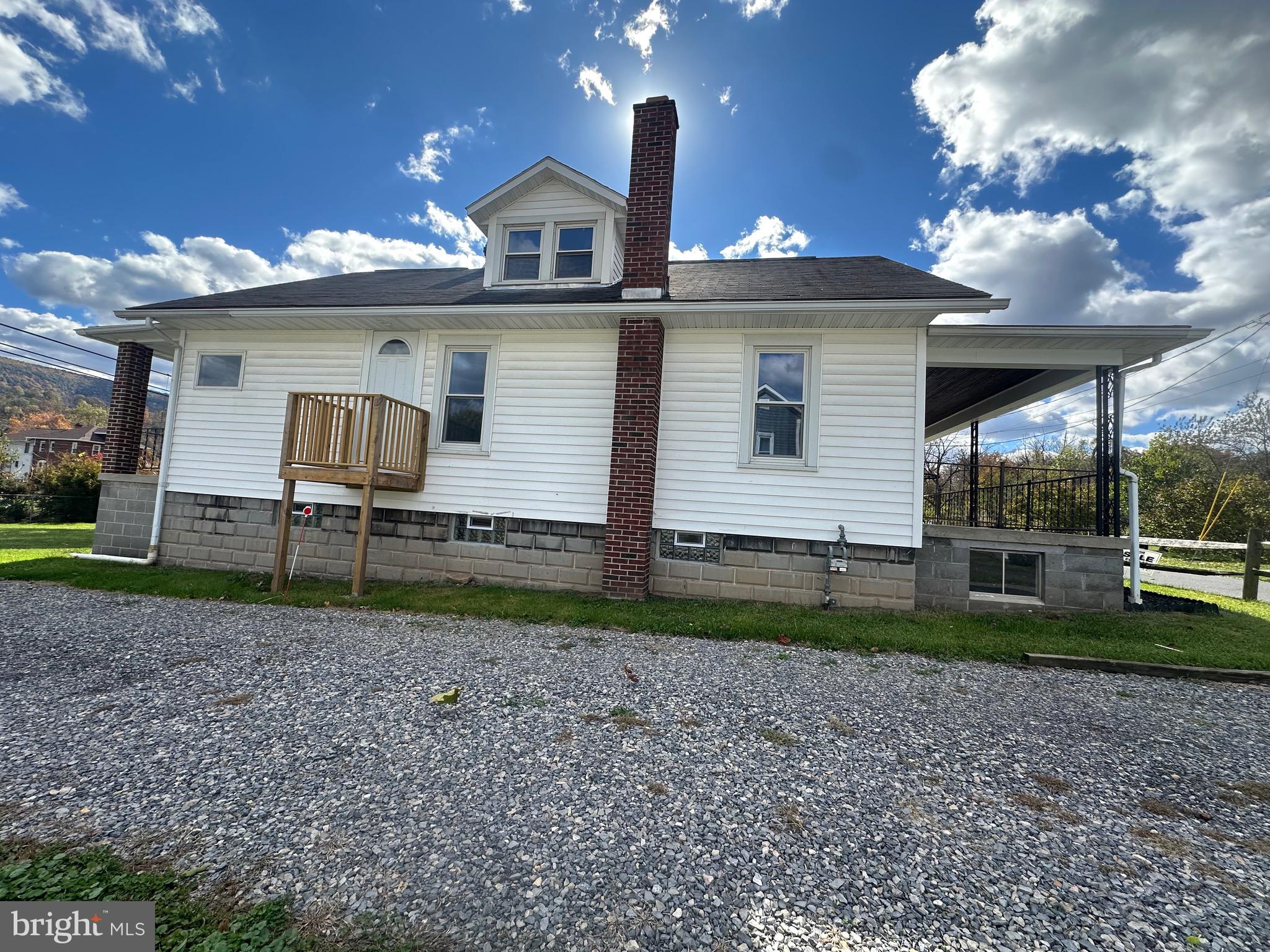 14204 Temple Street Ellerslie, MD 21529 - Photo 2 of 31 a view of a house with a yard and floor to ceiling window
