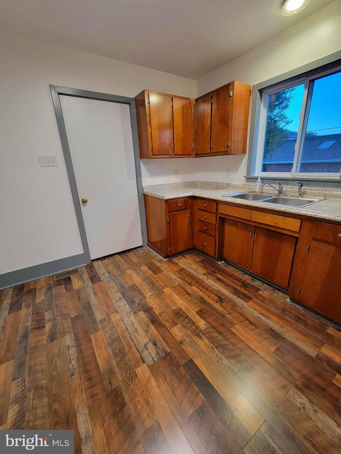 14204 Temple Street Ellerslie, MD 21529 - Photo 5 of 31 a kitchen with a sink window and cabinets