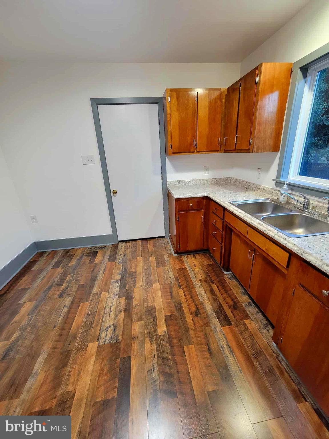 14204 Temple Street Ellerslie, MD 21529 - Photo 6 of 31 a kitchen with wooden floors and a sink