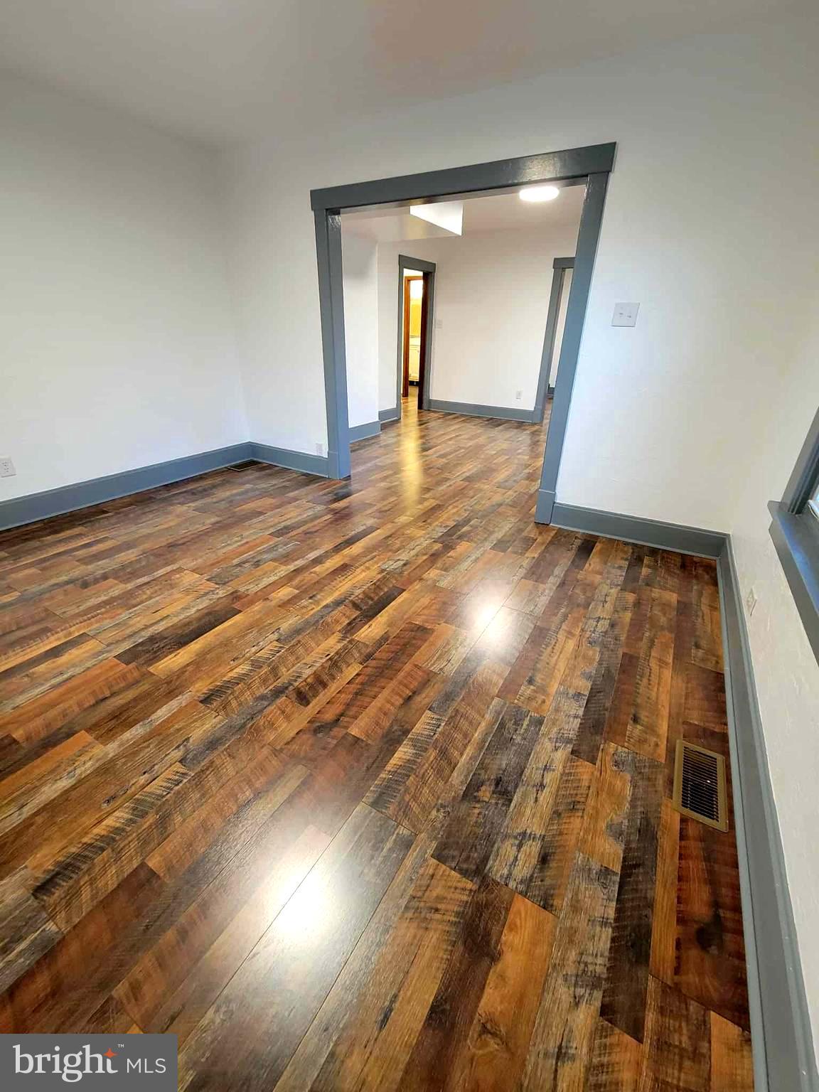 14204 Temple Street Ellerslie, MD 21529 - Photo 10 of 31 a view of an empty room and wooden floor