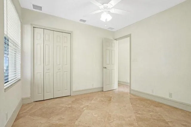 a bathroom with a toilet a sink and a mirror