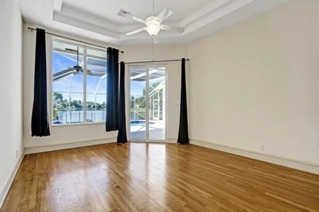 a bathroom with a tub sink and a mirror