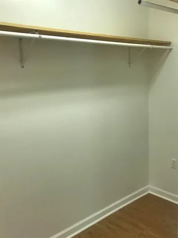 a view of a room with shelf on the wall