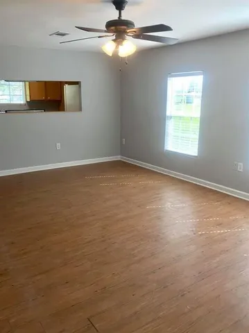 a view of an empty room with a window