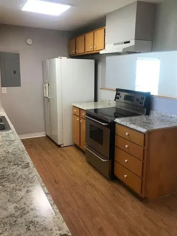 a kitchen with a stove and a sink