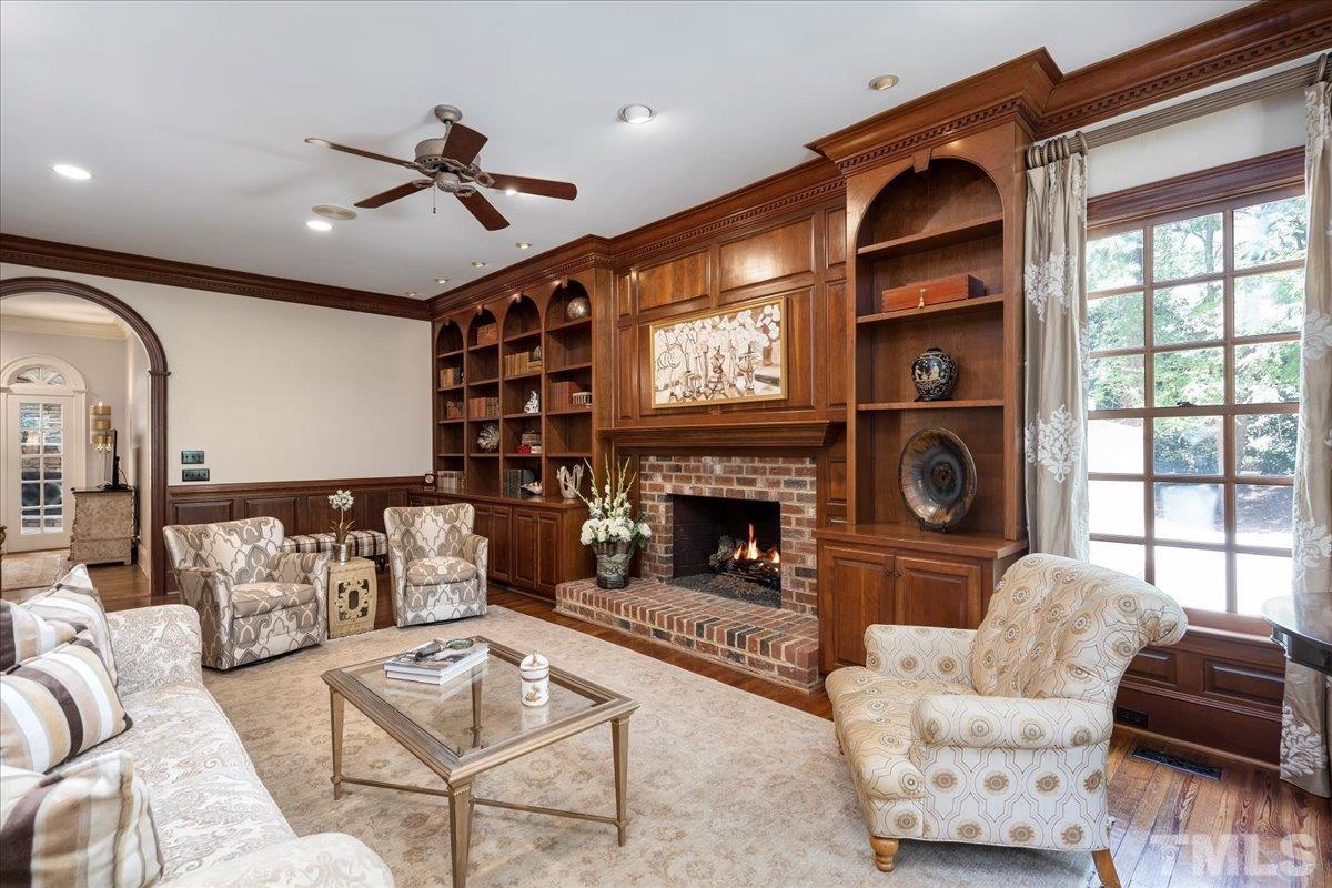 1213 Marlowe Road Raleigh, NC 27609 - Photo 12 of 30 a living room with furniture fireplace and a large window