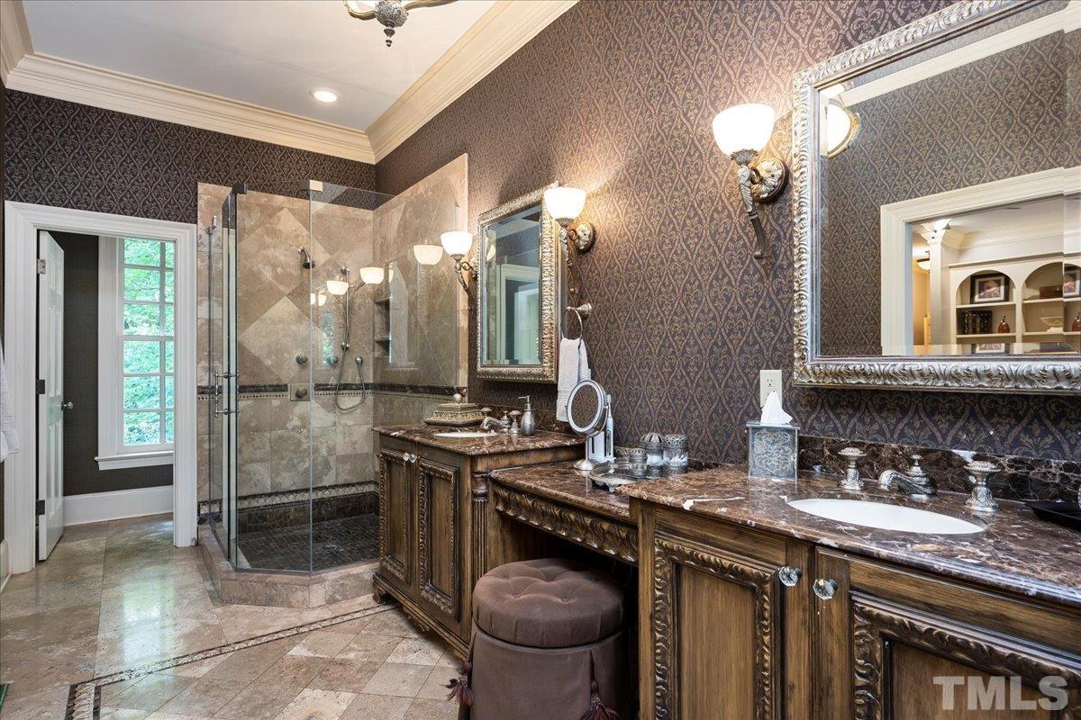 1213 Marlowe Road Raleigh, NC 27609 - Photo 14 of 30 a bathroom with a granite countertop sink a toilet and a mirror