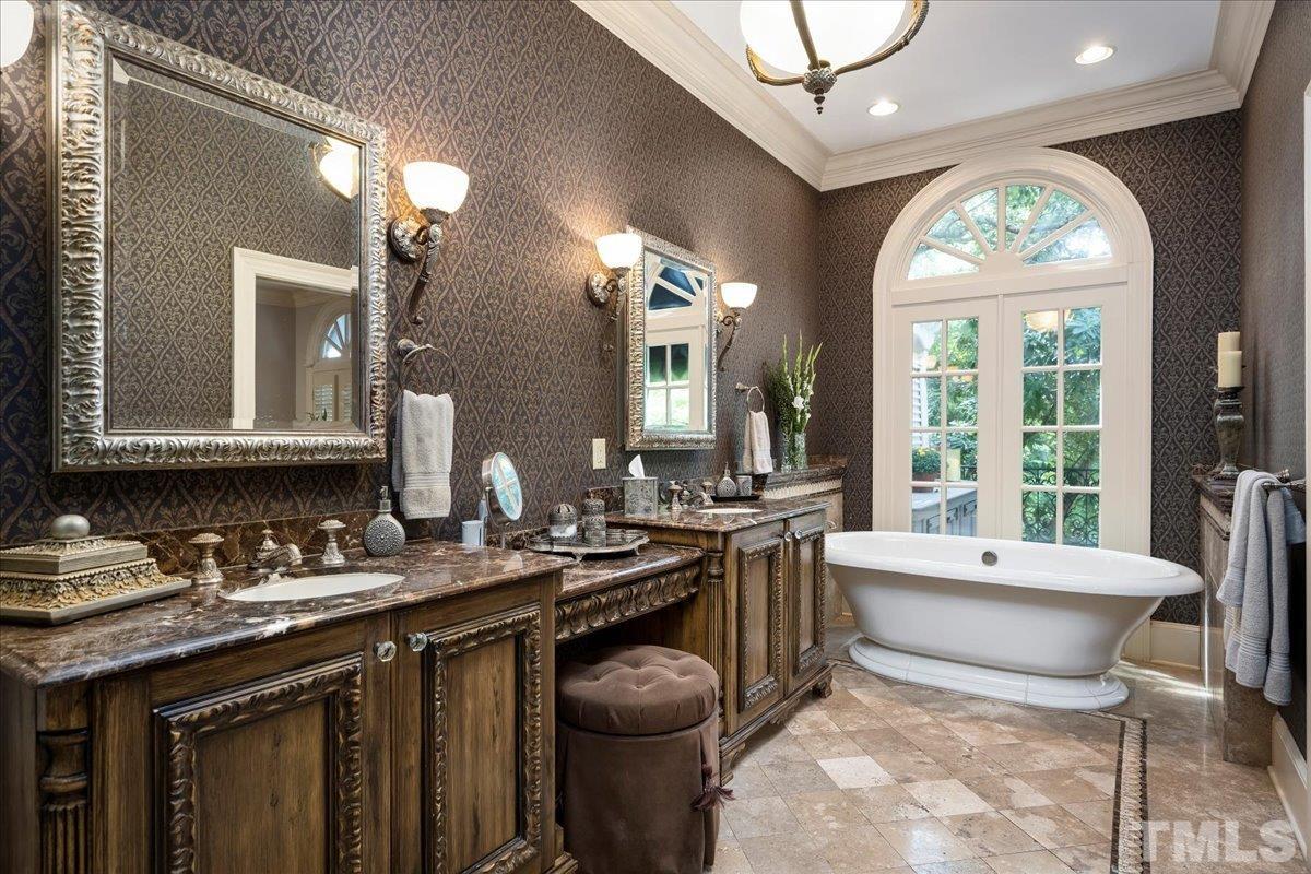 1213 Marlowe Road Raleigh, NC 27609 - Photo 15 of 30 a bathroom with a granite countertop sink and a mirror