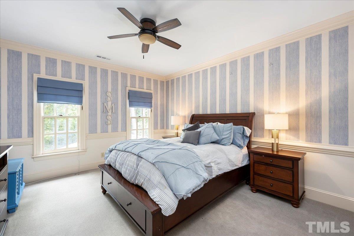 1213 Marlowe Road Raleigh, NC 27609 - Photo 21 of 30 a bed sitting in a spacious bedroom next to a window