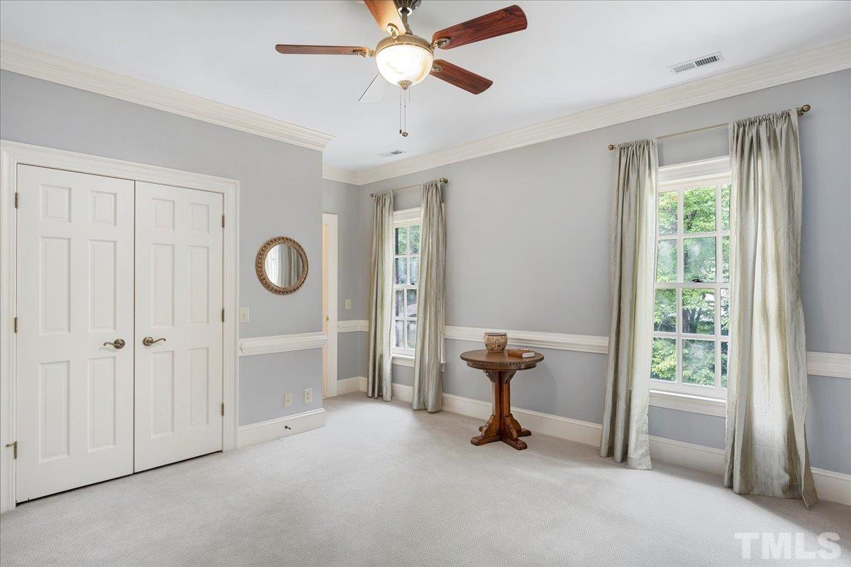 1213 Marlowe Road Raleigh, NC 27609 - Photo 24 of 30 a view of a room with cabinet mirror and windows