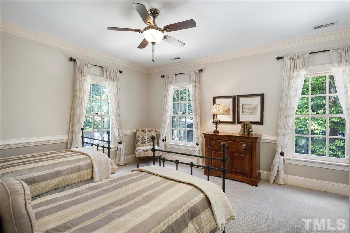 1213 Marlowe Road Raleigh, NC 27609 - Photo 26 of 30 a bedroom with a large bed and a window