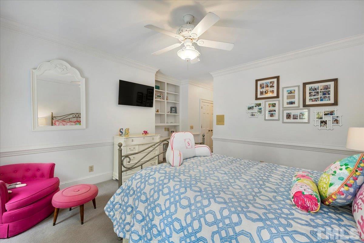 1213 Marlowe Road Raleigh, NC 27609 - Photo 28 of 30 a bedroom with a bed and a flat screen tv