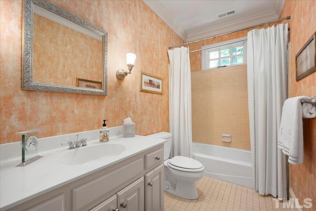 1213 Marlowe Road Raleigh, NC 27609 - Photo 30 of 30 a bathroom with a sink a toilet and shower