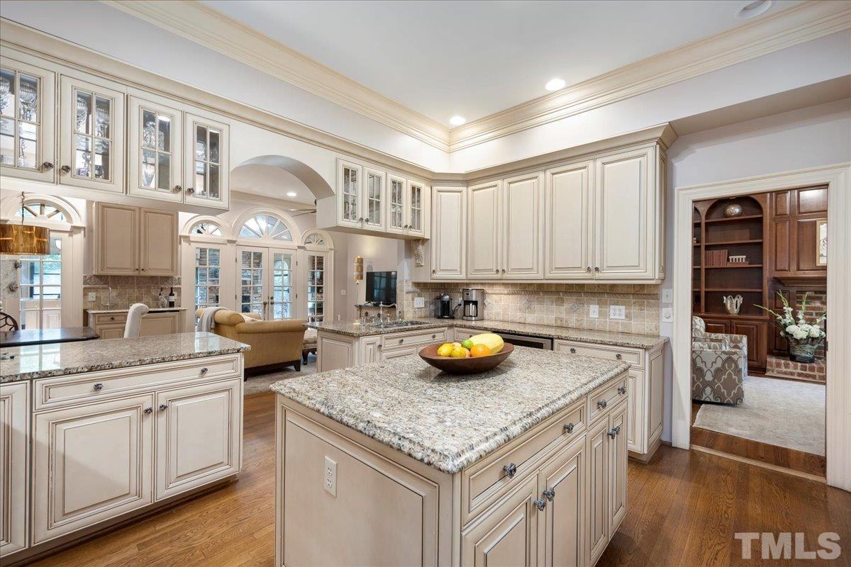 1213 Marlowe Road Raleigh, NC 27609 - Photo 8 of 30 a kitchen with a sink a stove and cabinets