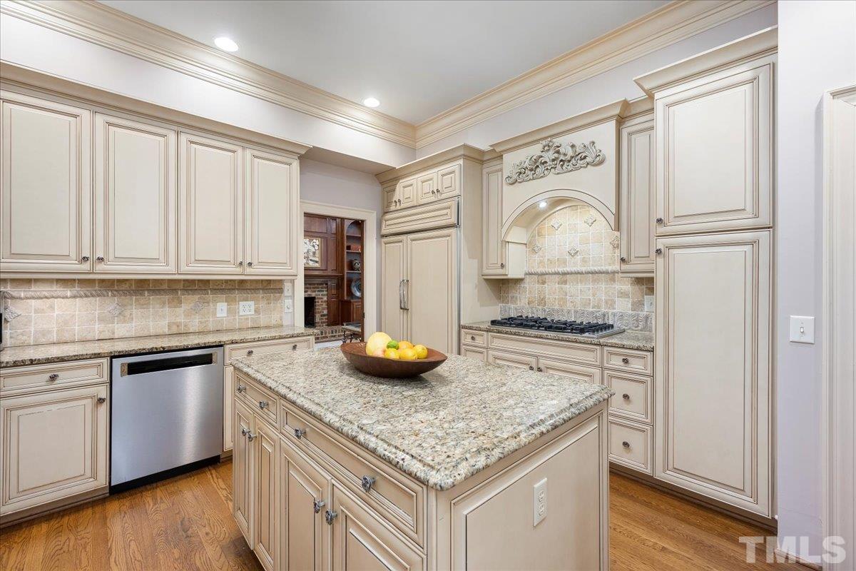 1213 Marlowe Road Raleigh, NC 27609 - Photo 10 of 30 a kitchen with stainless steel appliances granite countertop a sink stove and cabinets