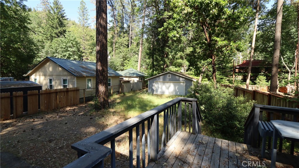 10466 Redwood Road Middletown, CA 95461 - Photo 11 of 14 a view of house with backyard and trees