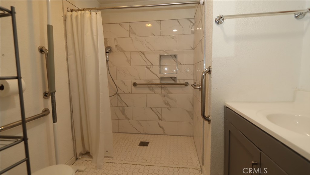 10466 Redwood Road Middletown, CA 95461 - Photo 7 of 14 a bathroom with a shower and a sink