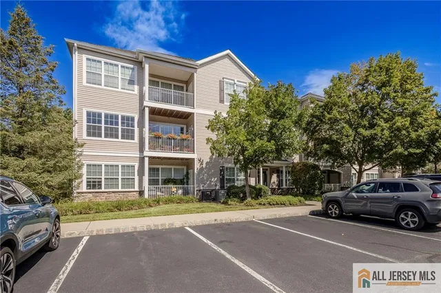 a view of a car parked in front of a building