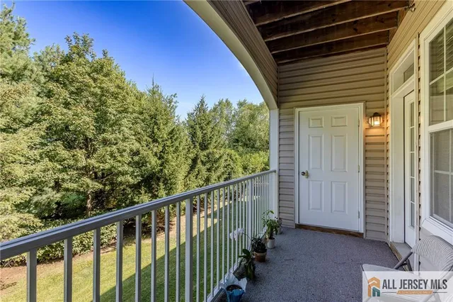 a spacious bedroom with a bed and window