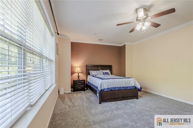 a spacious bathroom with a mirror a shower and a sink