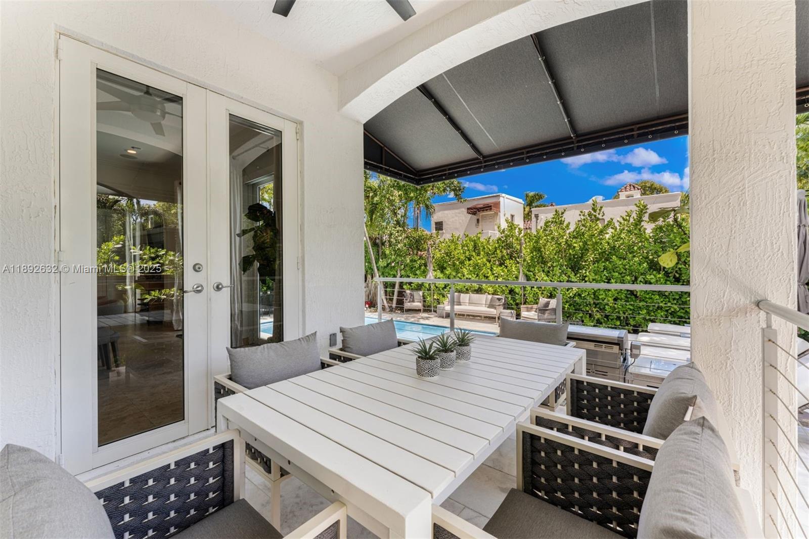 2143 North Bay Road Miami Beach, FL 33140 - Photo 16 of 39 a room with patio furniture and a window